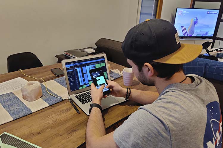 Nick working on a laptop