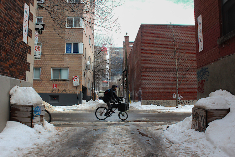 Cyclist delivering goods