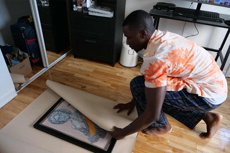 Man wraps piece of art