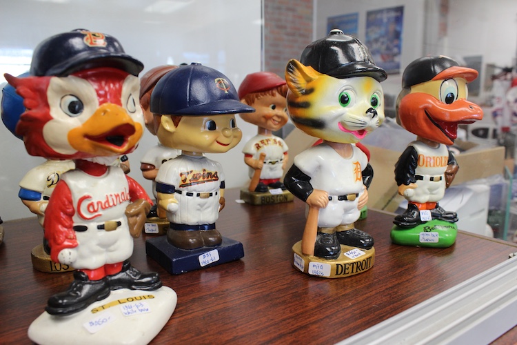 A glimpse of the selection of baseball mascot and player figurines at KSKS Sports Collectibles.