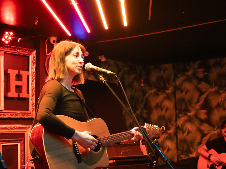 singer-songwriter performs at open mic at turbo haus