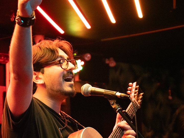 singer-songwriter performs at open mic at turbo haus
