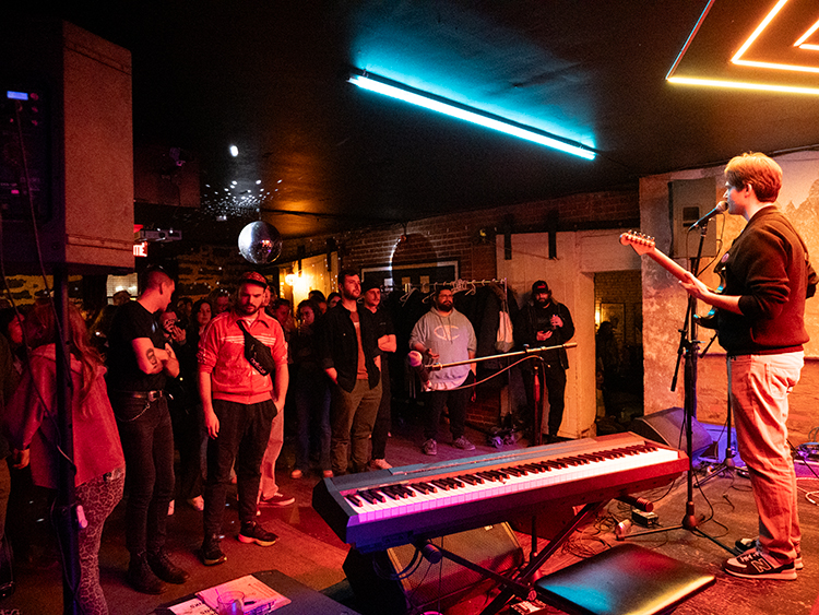 crowd at an open mic at turbo haus