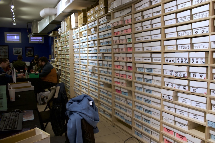 A shop's card stock lines its back wall.