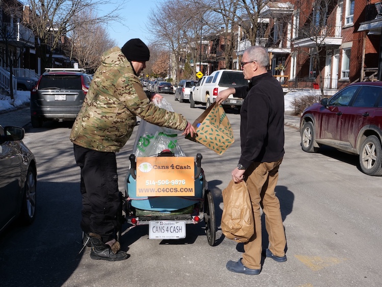 Aveline organically meets a fellow Verdun resident outside their home to collect donated empty cans and bottles.