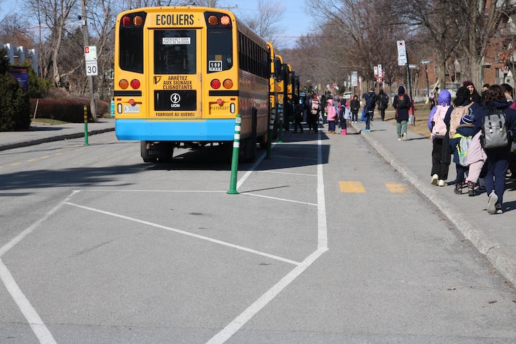 yellow school bus with children's crossing