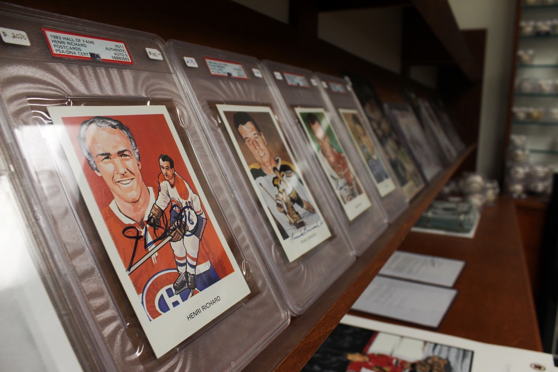 Incased autographed photos of hockey legends.