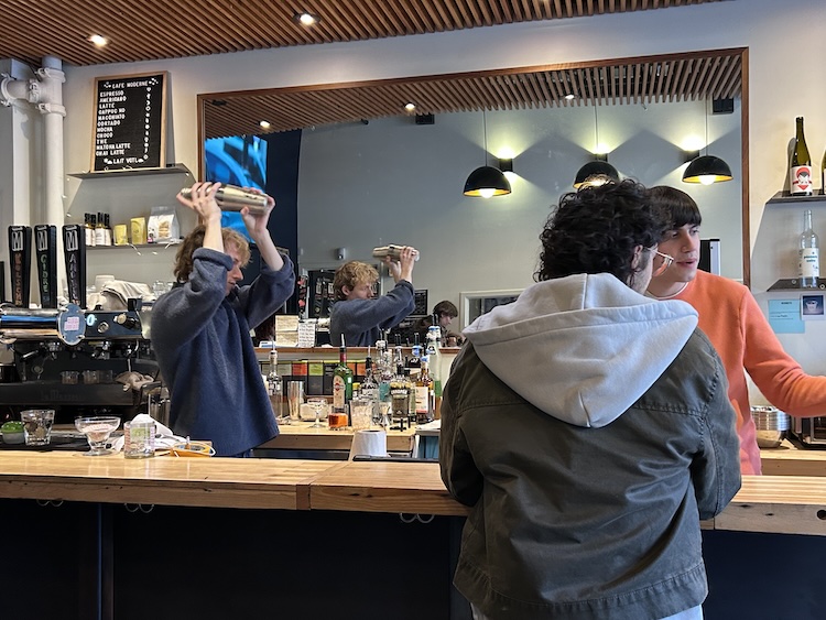 Movie goer ordering a drink at the bar before the movie